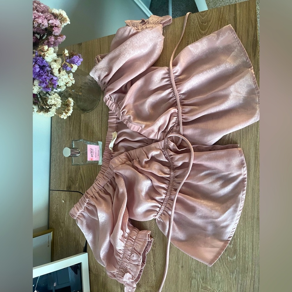 The brand By Together rose pink tie top.